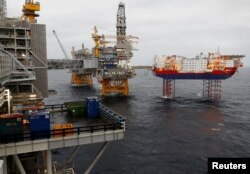 FILE - Equinor's Johan Sverdrup oilfield platforms and accommodation jack-up rig Haven are pictured in the North Sea, Norway, Dec. 3, 2019.