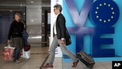 A man walks by an installation encouraging people to vote in the European elections at Luxembourg metro station in Brussels, May 24, 2019. About 400 million Europeans from 28 countries will head to the polls May 23-26 to choose lawmakers to represent them