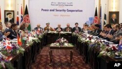President Ashraf Ghani, center, is seen during the so-called Kabul Process conference at the Presidential Palace in Kabul, Afghanistan, June 6, 2017. 