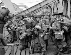 FILE - British troops disembark from an infantry landing ship on D-Day in Normandy, France, June 6, 1944.