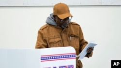 FILE - A voter casts an early ballot at a polling station February 9, 2023, in Milwaukee, Wisconsin. 