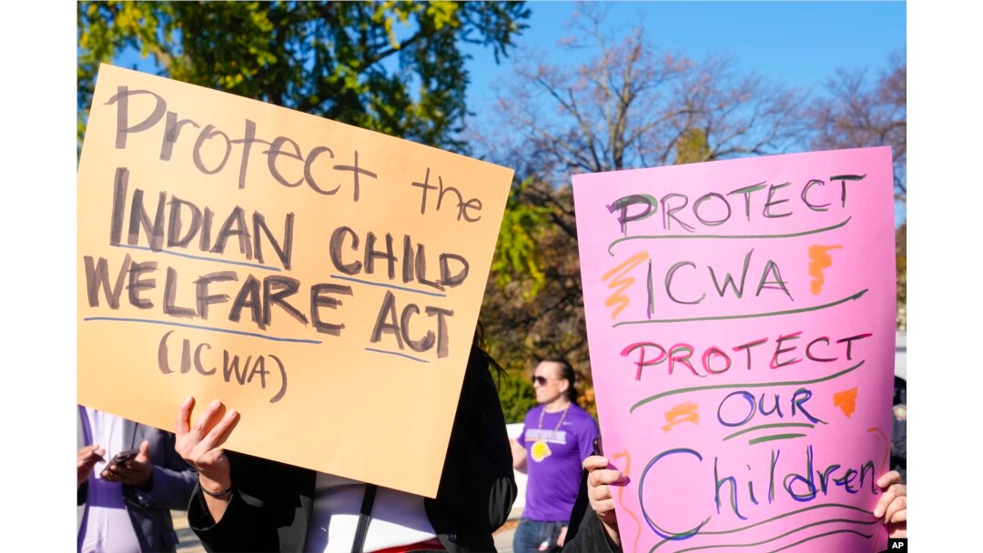 FILE - Demonstrators standing outside the U.S. Supreme Court in Washington, Nov. 9, 2022, as Justices heard arguments over the Indian Child Welfare Act.