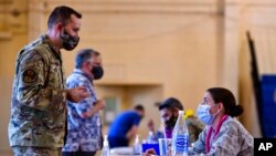 FILE - Hickam 15th Medical Group hosts the first COVID-19 mass vaccination on Joint Base Pearl Harbor-Hickam, Feb. 9, 2021, in this photo provided by the Department of Defense. 
