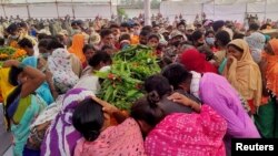 Relatives mourn around a coffin of a security force personnel, who was killed in an attack by Maoist fighters, during a wreath laying ceremony in Bijapur in the central state of Chhattisgarh, India, April 5, 2021. 