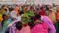 Relatives mourn around a coffin of a security force personnel, who was killed in an attack by Maoist fighters, during a wreath laying ceremony in Bijapur in the central state of Chhattisgarh, India, April 5, 2021. 