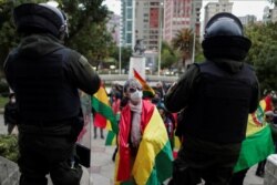 ​ Manifestantes participan en una protesta contra el presidente electo de Bolivia, Luis Arce, alegando un supuesto fraude en las elecciones generales, en La Paz, el jueves 22 de octubre de 2020. [Foto: Reuters] ​