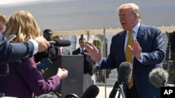 President Donald Trump speaks to reporters on the South Lawn of the White House in Washington, June 22, 2019, before boarding Marine One for the trip to Camp David in Maryland. 