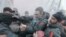 Opposition leader and former WBC heavyweight boxing champion Vitali Klitschko, center, is attacked and sprayed with a fire extinguisher as he tries to stop the clashes between police and protesters in central Kyiv, Ukraine.&nbsp;