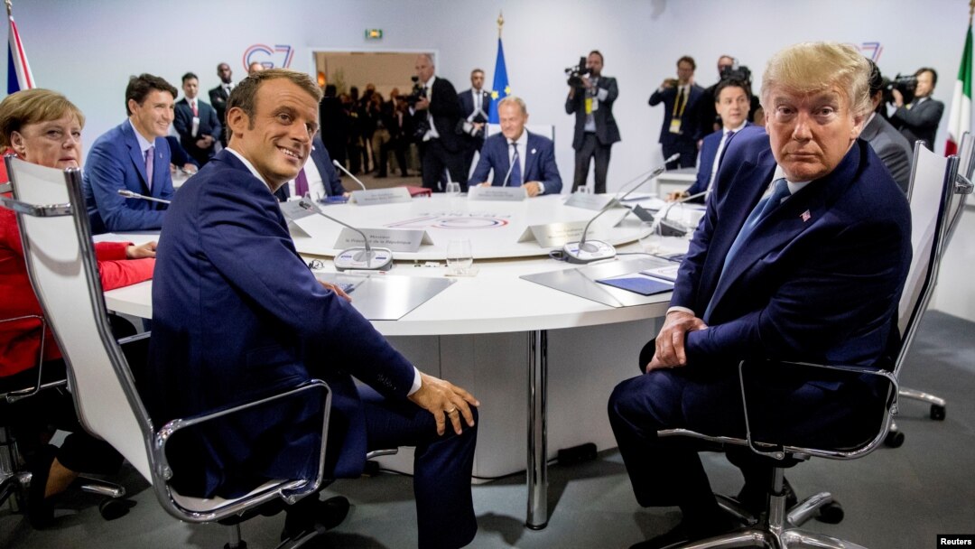 French President Emmanuel Macron and President Donald Trump participate in a G-7 Working Session on the Global Economy, Foreign Policy, and Security Affairs at the G-7 summit with German Chancellor Angela Merkel, Canadian Prime Minister Justin Trudeau.