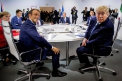 French President Emmanuel Macron and President Donald Trump participate in a G-7 Working Session on the Global Economy, Foreign Policy, and Security Affairs at the G-7 summit.