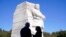 President Joe Biden and Vice President Kamala Harris stand together at the Martin Luther King Jr. Memorial as they arrive to attend an event marking the 10th anniversary of the dedication of memorial in Washington, Oct. 21, 2021.