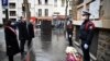 Paris Mayor Anne Hidalgo and French Prime Minister Jean Castex pay tribute outside La Belle Equipe bar to the victims of the November 2015 jihadist attacks in which 130 people were killed, in Paris, France, Nov. 13, 2020. 