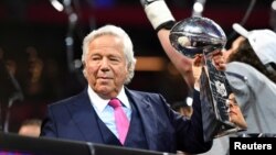 FILE - New England Patriots owner Robert Kraft raises the Vince Lombardi Trophy after winning Super Bowl LIII against the Los Angeles Rams at Mercedes-Benz Stadium in Atlanta, Georgia, U.S., Feb. 3, 2019. 