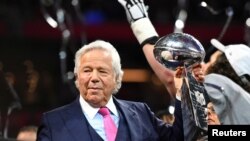 FILE - New England Patriots owner Robert Kraft raises the Vince Lombardi Trophy after winning Super Bowl LIII against the Los Angeles Rams at Mercedes-Benz Stadium in Atlanta, Georgia, U.S., Feb. 3, 2019. 