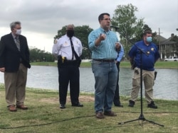 FILE - Council member Joseph Giarrusso (at microphone) speaks to a group of city residents, in New Orleans, Louisiana, April 9, 2021. (Twitter @CmGiarrusso)