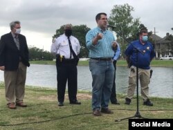 FILE - Council member Joseph Giarrusso (at microphone) speaks to a group of city residents, in New Orleans, Louisiana, April 9, 2021. (Twitter @CmGiarrusso)