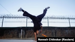 A Kung Fu nun practices before her performance at Druk Amitabha Mountain Nunnery in Kathmandu, Nepal December 30, 2024.