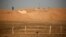 FILE - Moroccan soldiers are seen on an earth wall that separates areas controlled by Morocco and the Polisario Front in Western Sahara, Sept. 10, 2016.