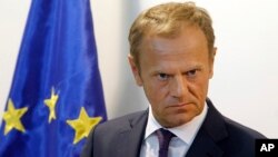 FILE - European Council President Donald Tusk talks to the media in presence of Macedonian President Gjorge Ivanov after their meeting at the presidential office in Skopje, Macedonia, April 3, 2017. 