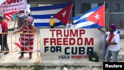 Ana Lacayo, (L) and Barbara Jimino, both of Miami, show their support for U.S. President Donald Trump near the Manuel Artime Theater in Miami, Florida, June 16, 2017. 