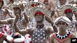 Sri Lankan traditional dancers perform during the 59th national Independence Day celebrations in Colombo, Sri Lanka, Sunday, Feb. 4, 2007. (AP Photo/Eranga Jayawardena)