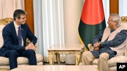 This photo handed out provided by Bangladesh Press Information Department (PID) shows Brent Neiman, US Assistant Secretary of the Treasury for International Finance and Development, left, speaking with Muhammad Yunus in Dhaka, Sep. 15, 2024.