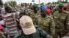 Niger's National Council for the Safeguard of the Homeland (CNSP) Colonel-Major Amadou Abdramane (C), General Mohamed Toumba (C-L) and Colonel Ousmane Abarchi (R) are greeted by supporters upon their arrival at the Stade General Seyni Kountche in Niamey Niger on August 6, 2023. 