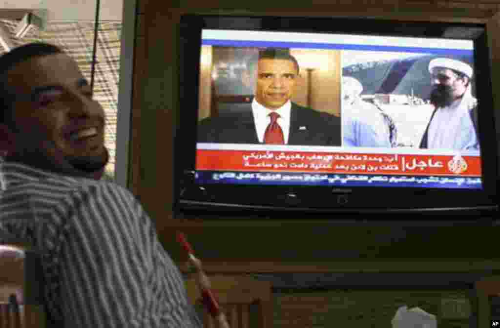 A Jordanian man reacts as he watch a TV news report about the killing of Osama bin Laden at a coffee shop in Amman, Jordan, Monday, May 2, 2011 (AP Photo/ Nader Daoud)