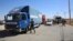 Trucks laden with aid for displaced Syrians wait to cross from Jordan to the Syrian side of the border, in Jabir As Sirhan, Jordan, July 1, 2018. 