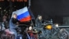 Russian President Vladimir Putin riding alongside the leader of the Night Wolves Alexander Zaltostanov aka the Surgeon