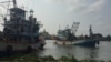 A fishing boat pulls into a port in Samut Sakhon, Thailand, March 25, 2018. 