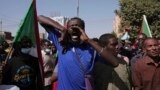 FILE: In one of hundreds of demonstrations since the military coup, tens of thousands of Sudanese calling for a civilian government march near the presidential palace in Khartoum, Sudan. Taken 11.30.2021