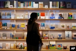FILE - Books of Haruki Murakami are displayed at the university's new international house of literature as known as The Haruki Murakami Library at Waseda University Wednesday, Sept. 22, 2021 in Tokyo. (AP Photo/Eugene Hoshiko)