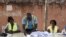 An electoral worker sorts ballots during the counting of votes for Guinea-Bissau's presidential runoff on Dec. 29, 2019, in Bissau.