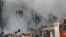 A view shows smoke rising after a suicide car bomb exploded in the main business district of Damascus, April 8, 2013.
