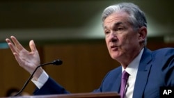 FILE - Federal Reserve Board Chair Jerome Powell testifies on Capitol Hill in Washington, July 17, 2018. 