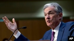 FILE - Federal Reserve Board Chair Jerome Powell testifies on Capitol Hill in Washington, July 17, 2018. 