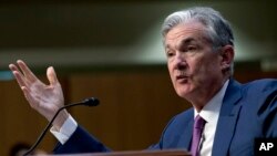 FILE - Federal Reserve Board Chair Jerome Powell testifies on Capitol Hill in Washington, July 17, 2018. 
