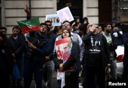 Supporters of Pakistan’s former Prime Minister Imran Khan protest against his arrest, outside Avenfield House, a residential building where former Pakistani Prime Minister Nawaz Sharif is reported to own a property in London, Britain May 10, 2023.