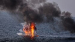 An explosion is seen on an oversea target during a joint exercise called the 'Great Prophet 17', in the southwest of Iran, in this picture obtained on Dec. 22, 2021.