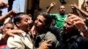The relatives of seven kidnapped security officers and soldiers celebrate after their return, in the Rafah border, Egypt, May 22, 2013. 