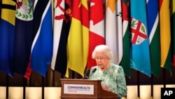 Britain's Queen Elizabeth II speaks during the formal opening of the Commonwealth Heads of Government Meeting in the ballroom at Buckingham Palace in London, April 19, 2018.
