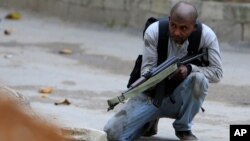 A Palestinian Fatah member takes up a position in the Ain el-Hilweh Palestinian refugee camp in southern Lebanon, Feb. 28, 2017. 