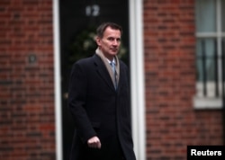 FILE - Britain's Foreign Secretary Jeremy Hunt arrives in Downing Street, London, Britain, Dec. 18, 2018.