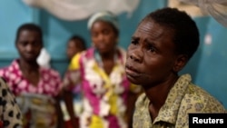 FILE - A Congolese victim of ethnic violence rests inside a ward at the General Hospital in Bunia, Ituri province, in the eastern Democratic Republic of Congo, June 25, 2019.