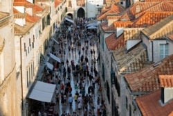 FILE - Tourists walk through Dubrovnik, Croatia, Sept. 7, 2018.