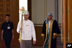 Parliament chairman Mann Win Khaing Than, right, walks to attend the inauguration session of Union Parliament, Feb. 8, 2016, in Naypyitaw, Myanmar.