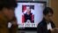 FILE - A TV news program shows Kim Yo Jong, North Korean leader Kim Jong Un's younger sister, at Seoul Railway Station in Seoul, South Korea, Nov. 27, 2014.