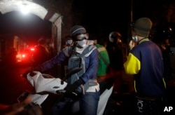 Villagers on their motorbikes after evacuating from their homes which are located near to the crater of Mount Agung, in Besakih village, Karangasem, Bali, Indonesia, Nov. 25, 2017.