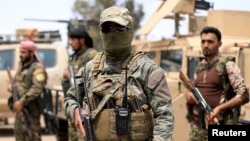 Fighters of Syrian Democratic Forces (SDF) are seen in Deir el-Zour, Syria, May 1, 2018.